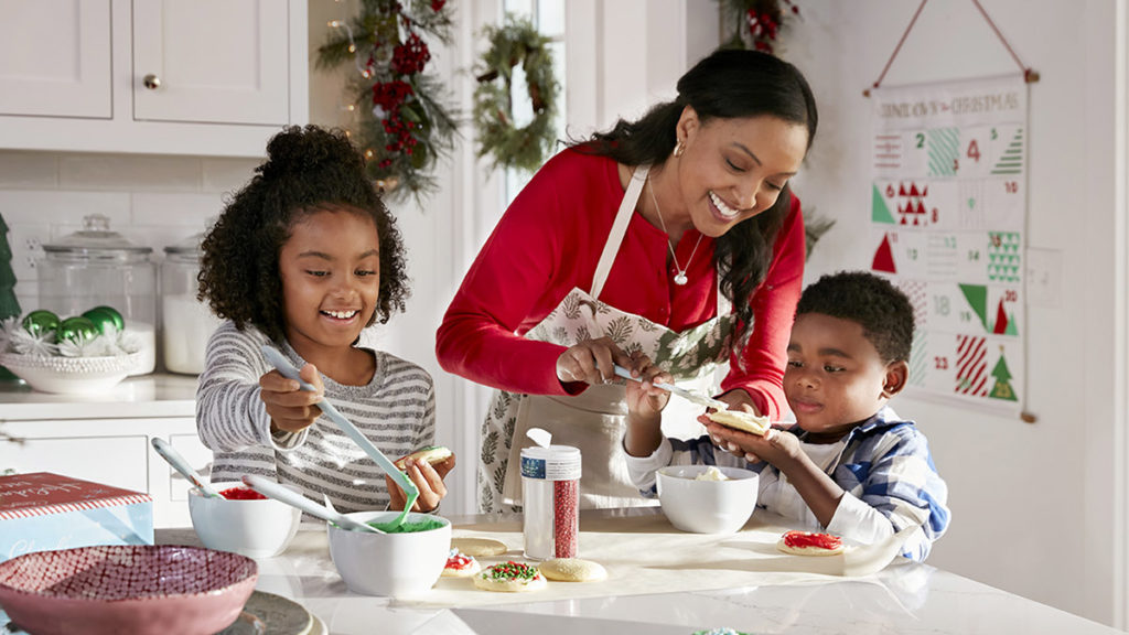 Photo of family frosting cookies