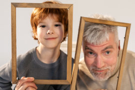 Photo of a grandfather and his grandson acting silly