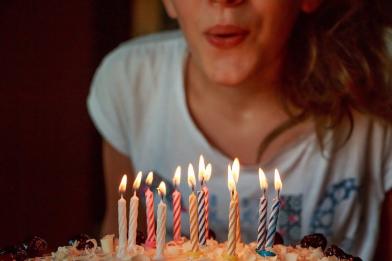 Photo of blowing out candles