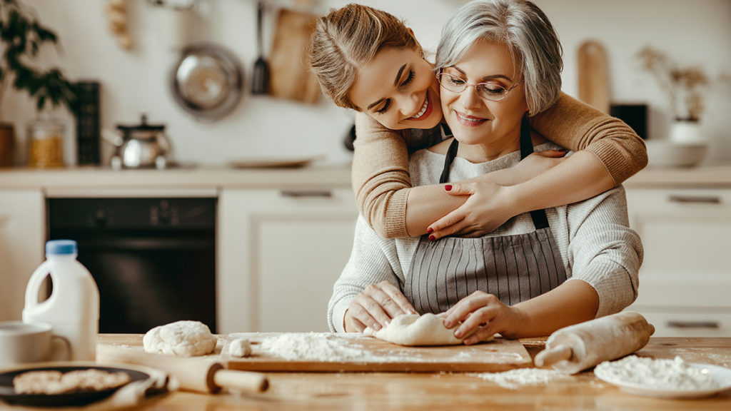 Photo of granddaughter embracing grandmother