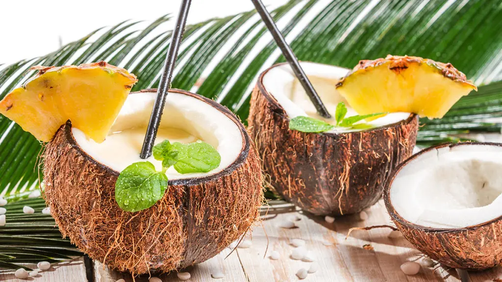 Photo of coconuts and pineapples