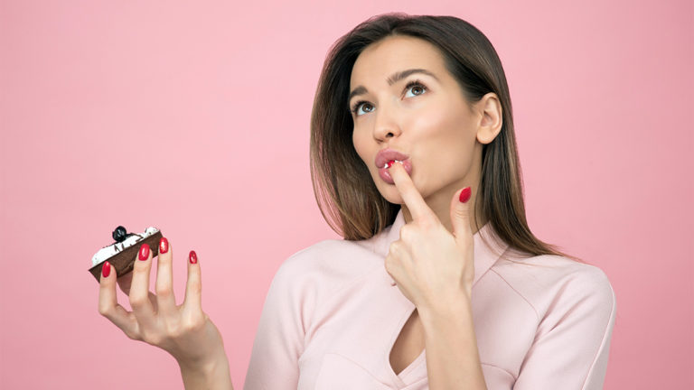 Photo of woman enjoying a sweet treat