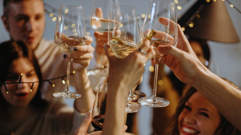 Photo of people toasting at a housewarming party