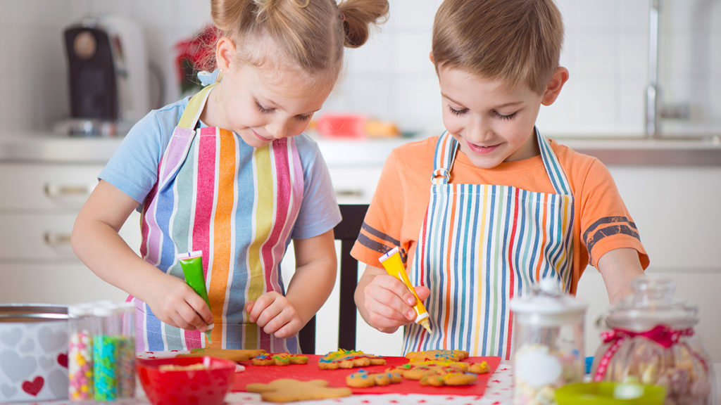 Photo of kids decorating cookies