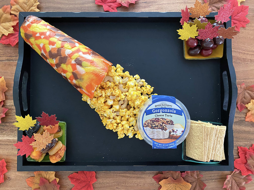 fall dessert board with adding leaves and popcorn