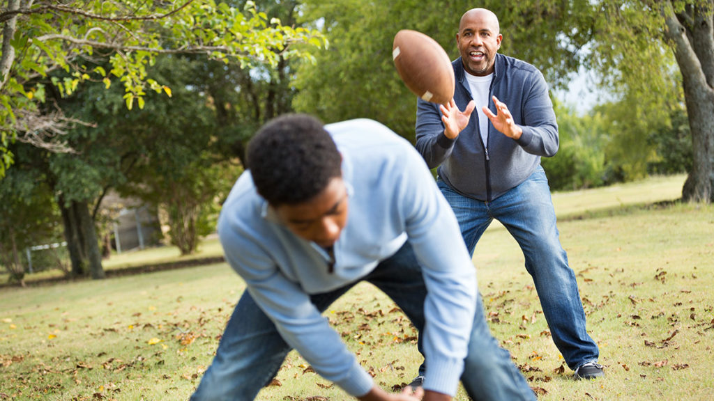 Photo of adults playing football