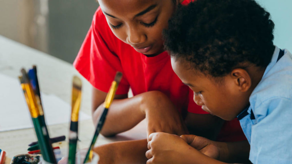 Photo of kids making birthday invitations