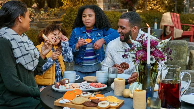 Photo of family eating fall cookies
