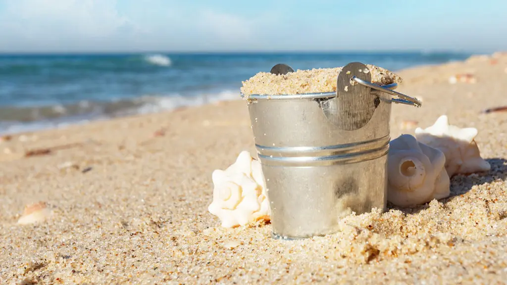 Photo of a metal pail at the beach