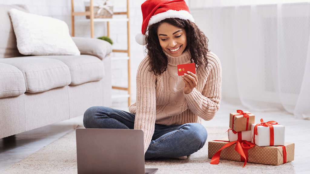 Photo of a woman doing holiday shopping online
