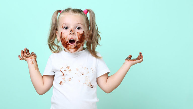 Photo of a girl with chocolate on her face
