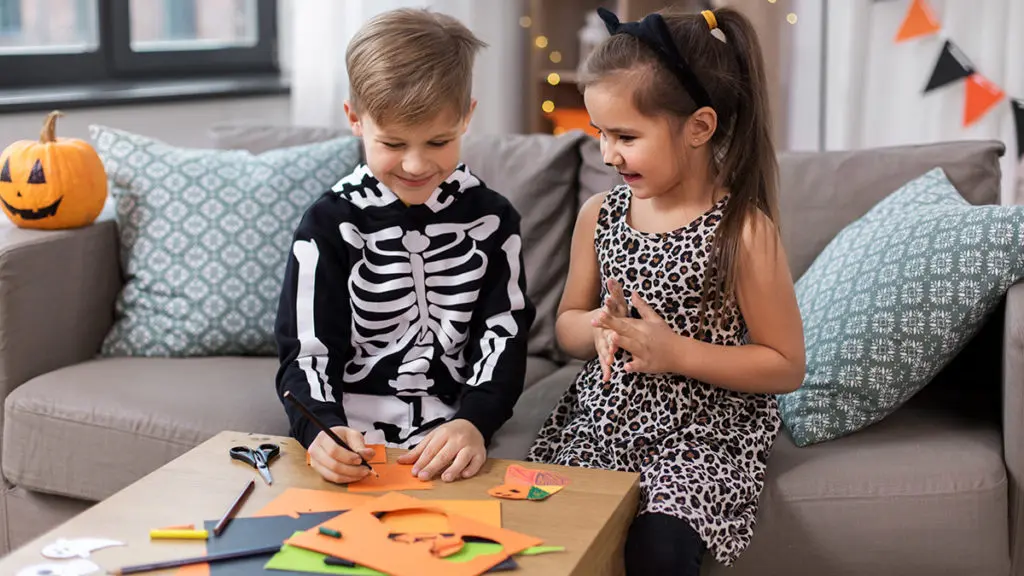 Photo of kids making Halloween crafts