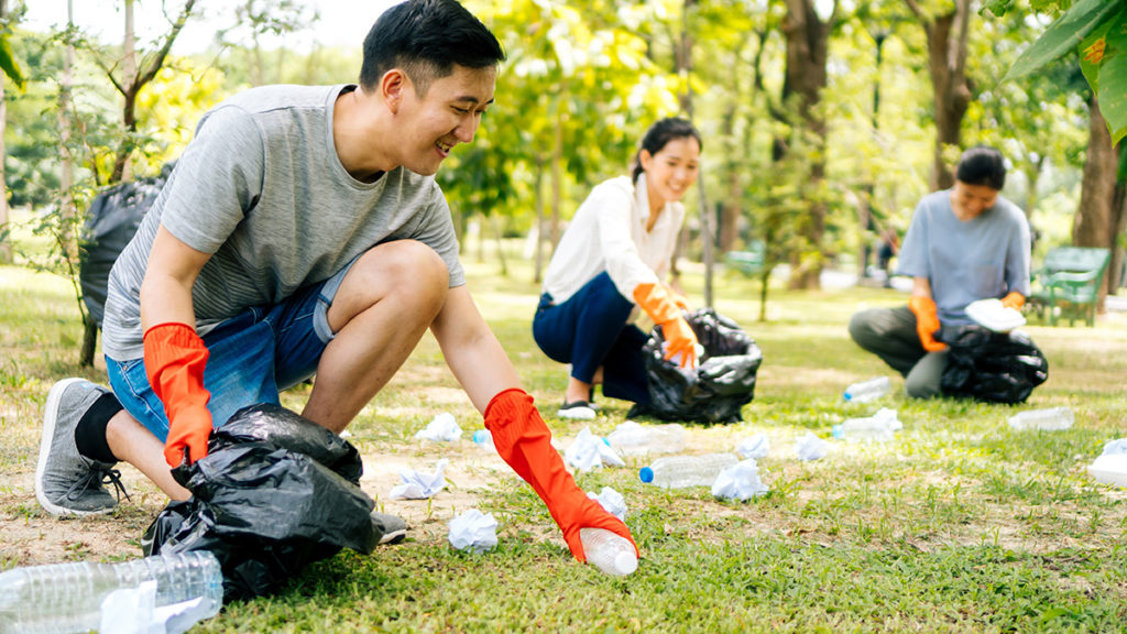 Photo of people cleaning up a park