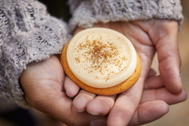 Photo of a fall pumpkin cookie with buttercream frosting