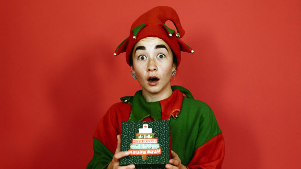 Photo of Christmas elf with gifts