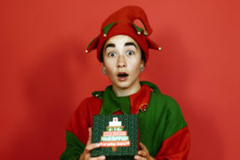 Photo of Christmas elf with gifts