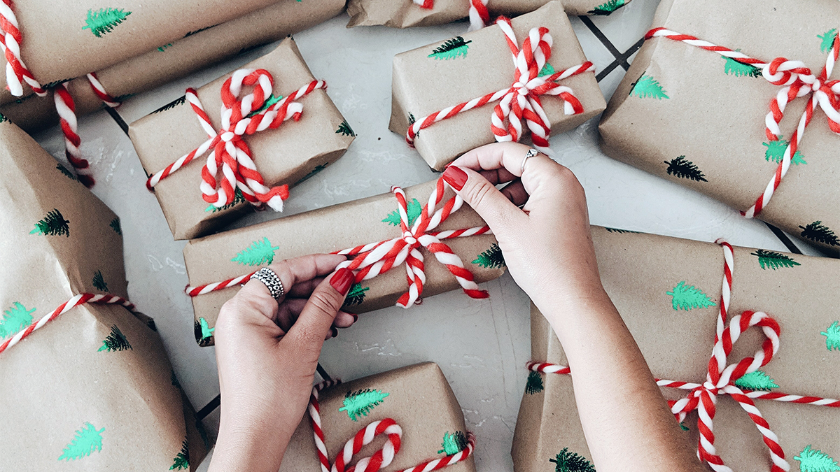 Photo of someone wrapping Christmas gifts