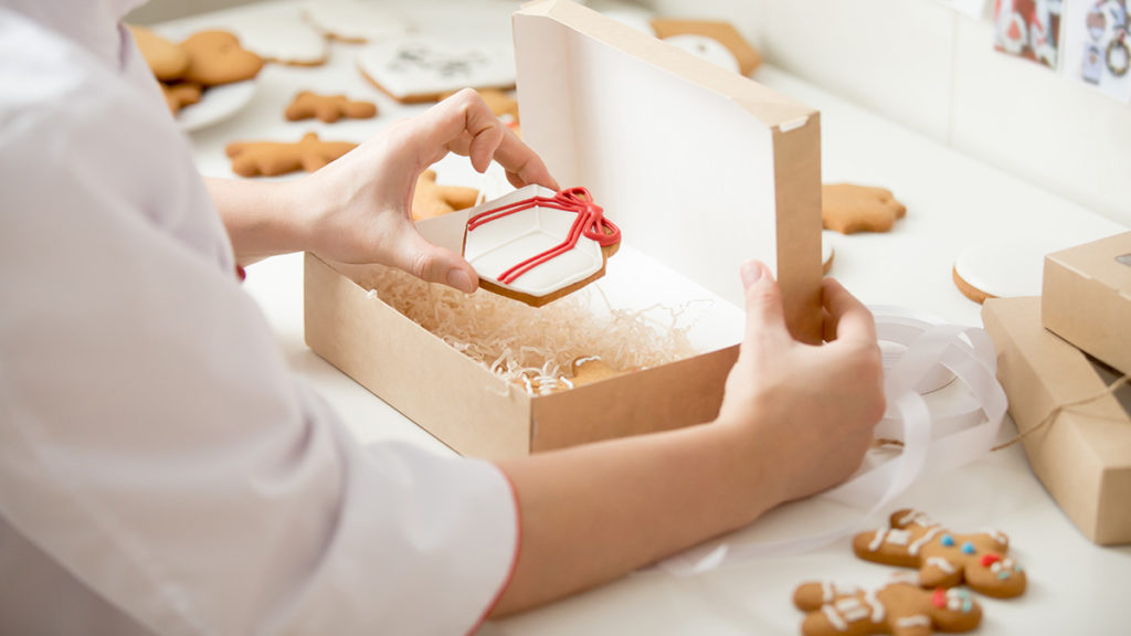 Photo of person boxing cookies on National Cookie Day