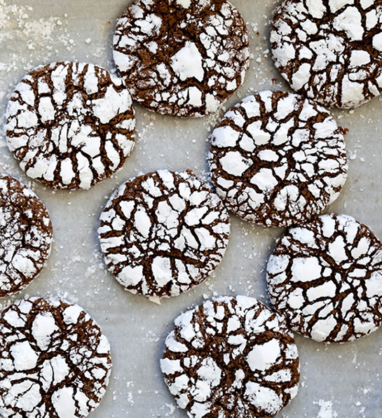 Cookie types with chocolate crinkle cookies on a cookie sheet.