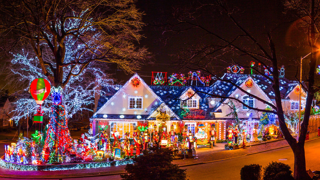 Photo of house decorated with Christmas lights