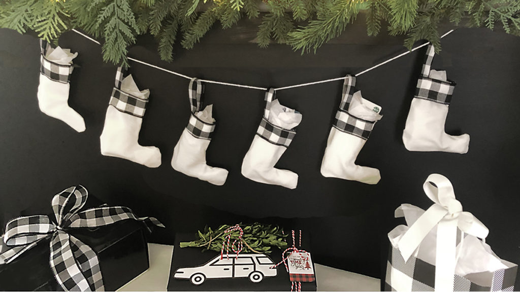 diy christmas stocking with white stockings with black and white buffalo plaid ribbon cuffs