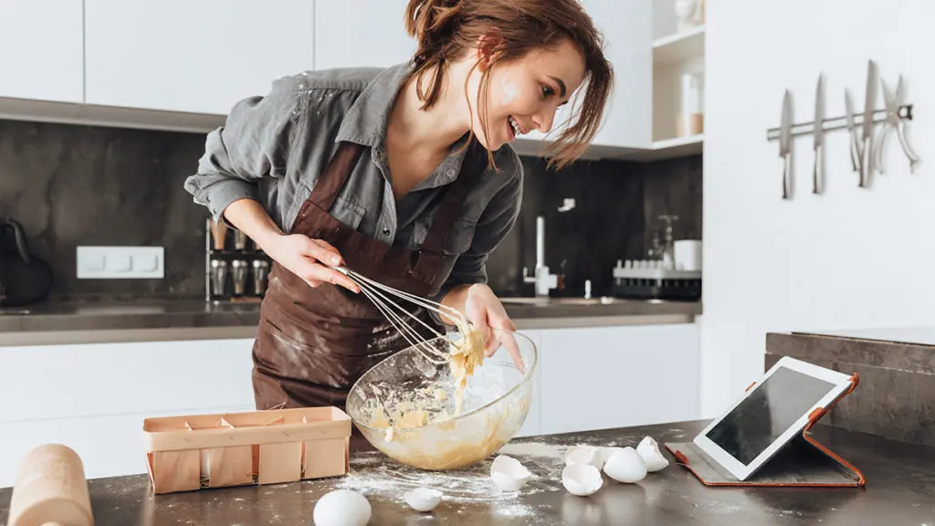 Food puns with a woman mixing batter in a bowl