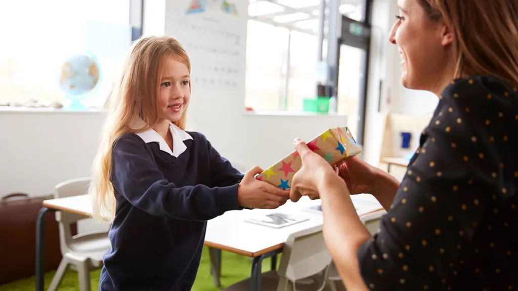 randon-acts-of-kindness-day: girl giving teacher a gift