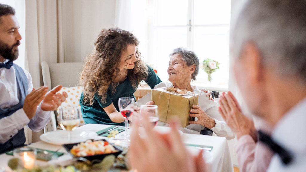 birthday party ideas for seniors with older woman receiving a present