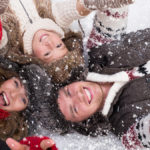winter-bucket-list-ideas: family in snow