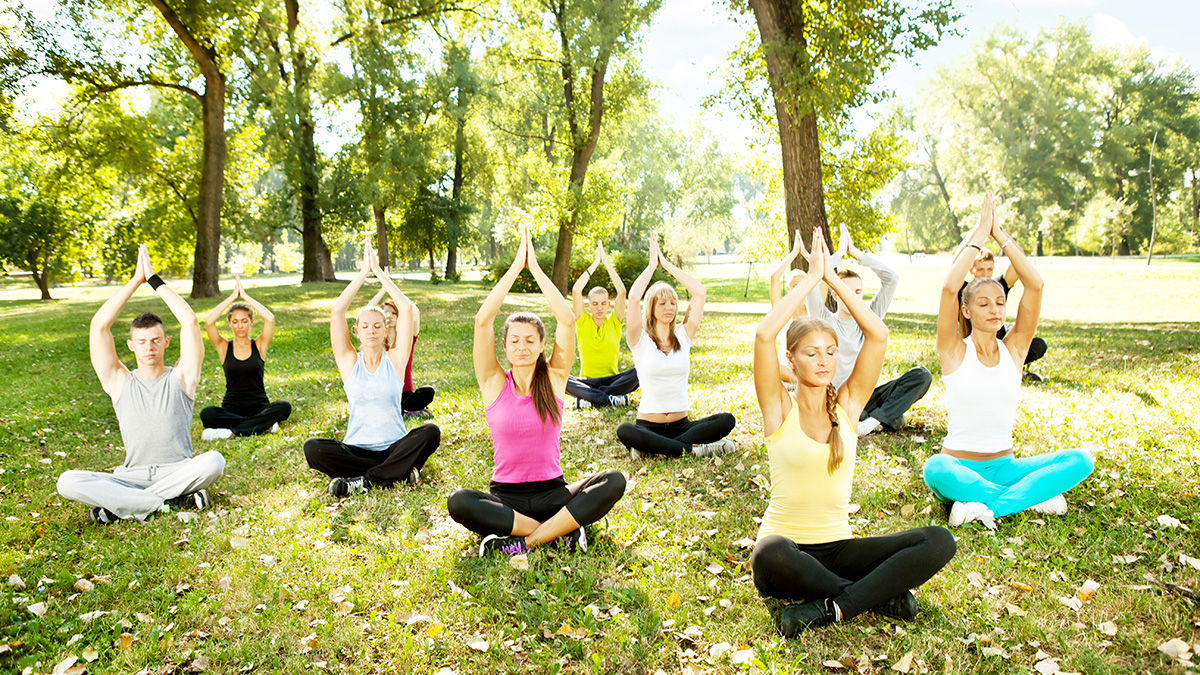 spring self-care ideas: adults doing yoga