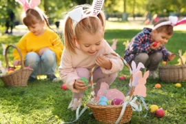 photo of easter egg hunt ideas: kids hunting for easter eggs