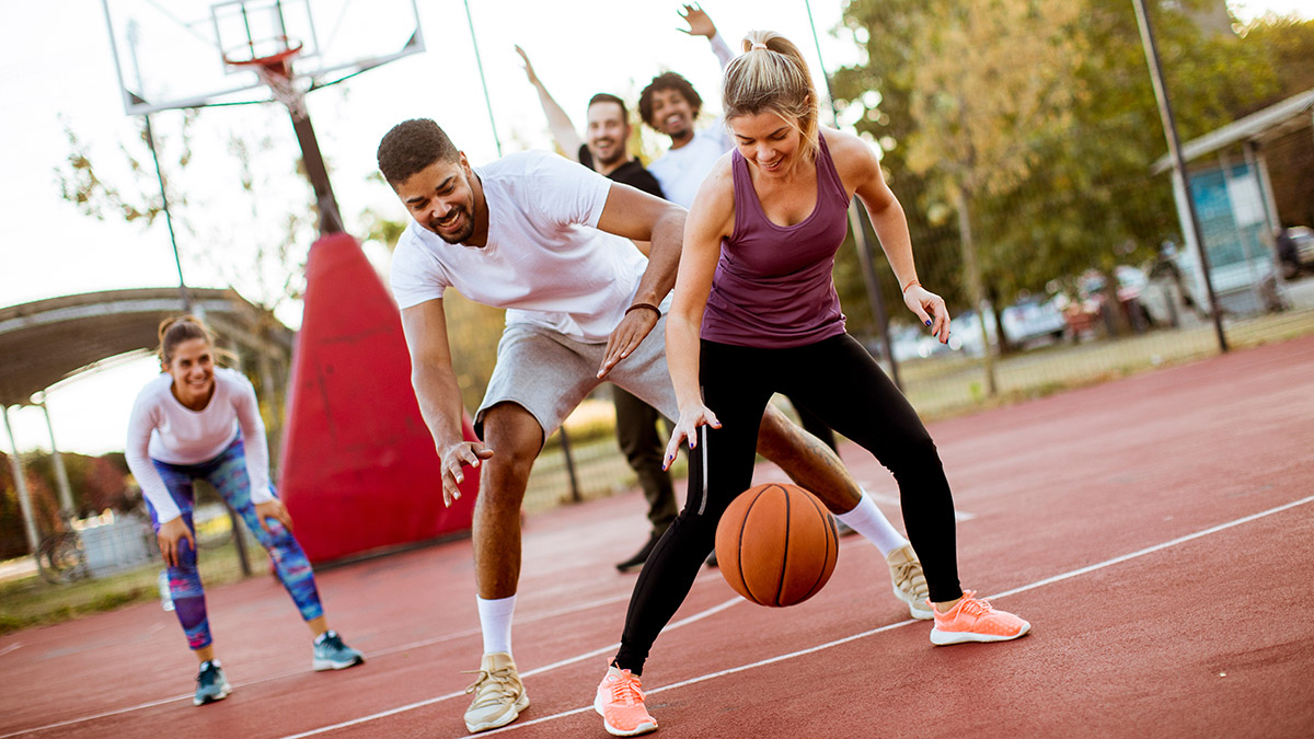 spring self-care ideas: adults playing basketball