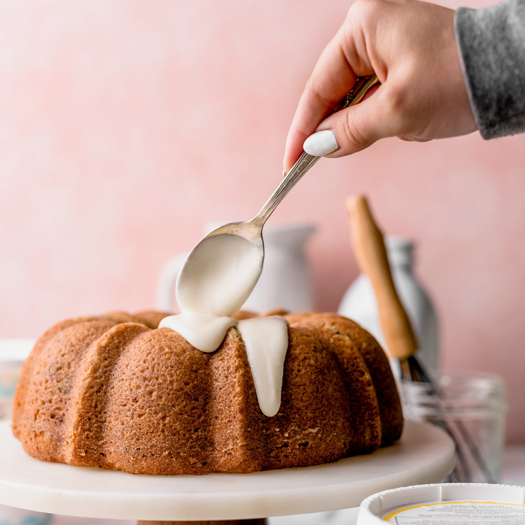a photo of carrot bundt cake with drizzling glaze