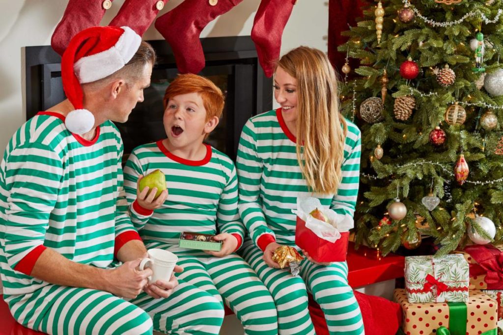 a photo of how to be the best gift giver: family on christmas morning