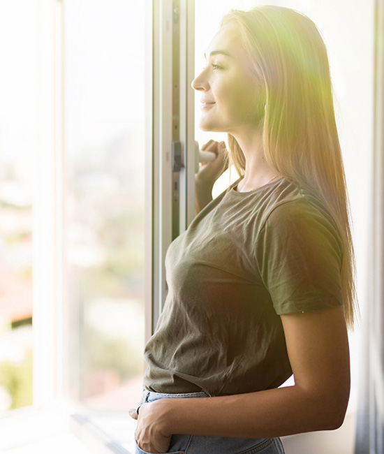 inspiring spring quotes: woman looking out window