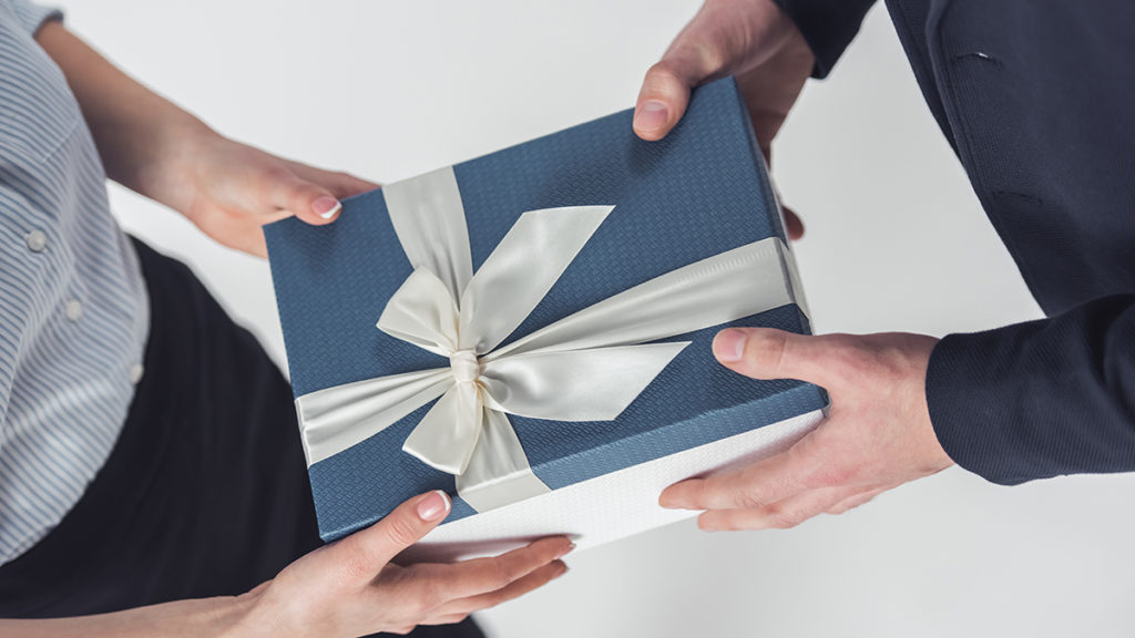 a photo of gift ideas for administrative professionals day: exchanging a gift