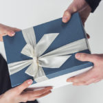 a photo of gift ideas for administrative professionals day: exchanging a gift