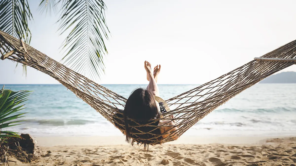 a photo of mother's day ideas: mom relaxing on the beach