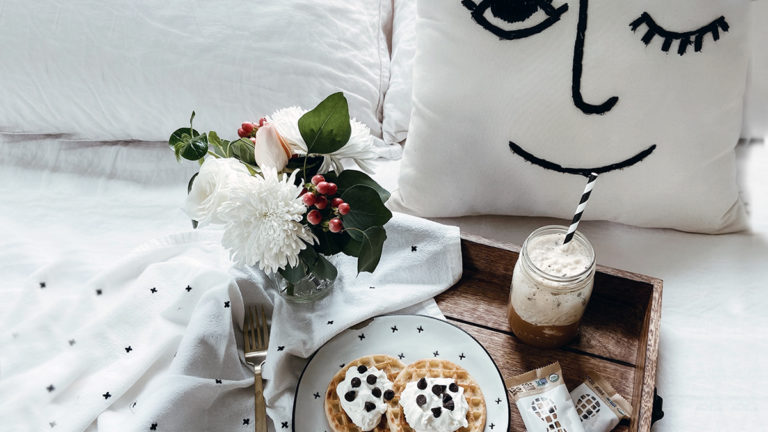 a photo of how moms want to spend mother's day: breakfast in bed