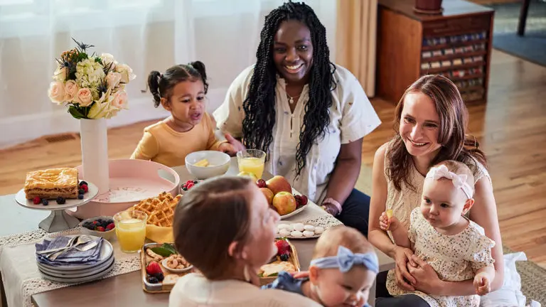 a photo of gifts for new moms: moms eating brunch