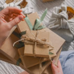 a photo of a woman opening a gift