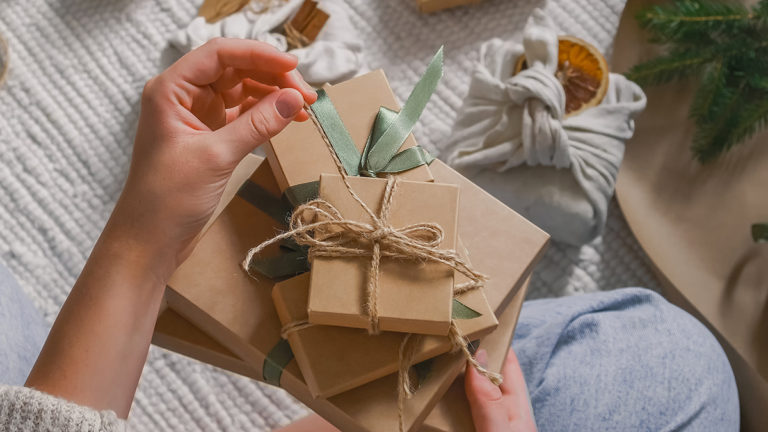 a photo of a woman opening a gift