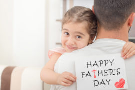 A photo of father's day messages with daughter giving dad father's day card