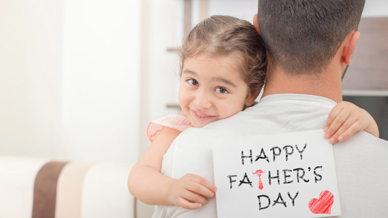 A photo of father's day messages with daughter giving dad father's day card