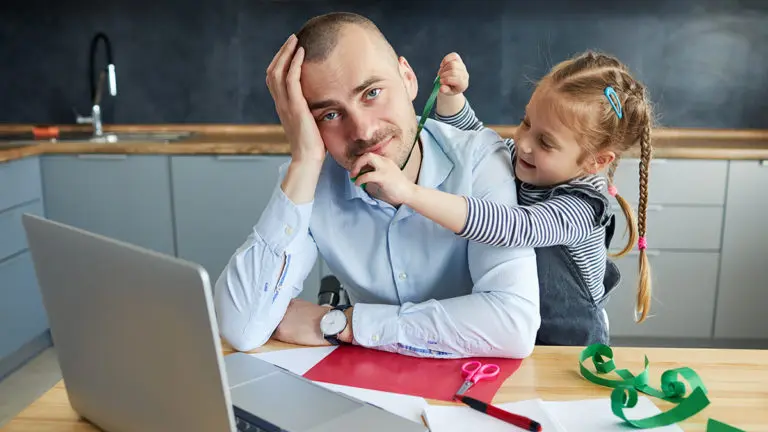 a photo of daddy brian with a dad working from home with his daughter