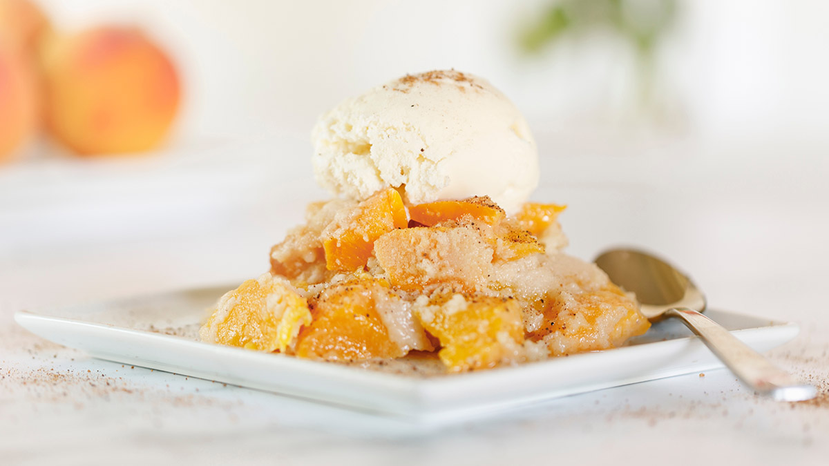 a photo of facts about peaches with a plate of peach cobbler