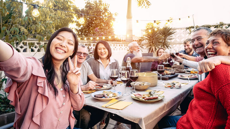 family reunion ideas with happy family cheering and toasting