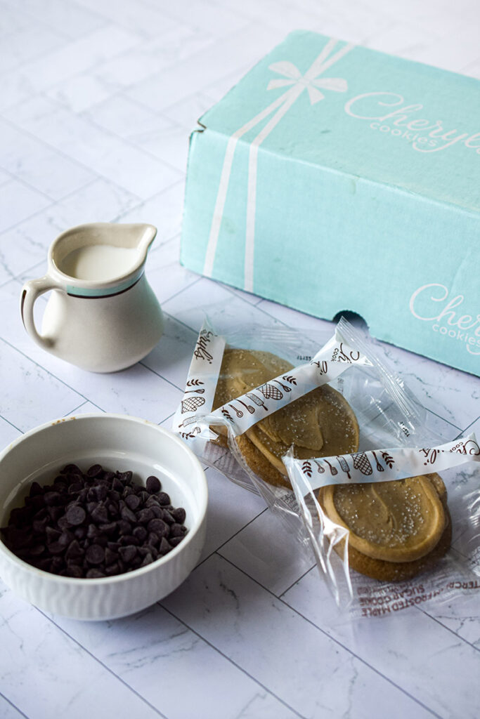 cookie pops with cookies in packaging with milk and chocolate chips