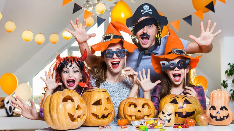 halloween hacks family dressed up in Halloween costumes.