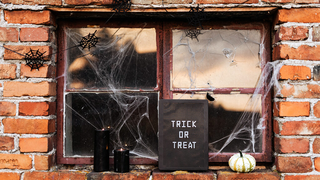 history of halloween trick or treat sign